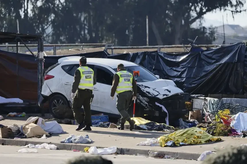 Emergency responders work at the scene after a vehicle crashed into an open-air market in Viña del Mar, Chile. - Sebastian Cisterna/ATON via AP