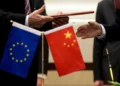 Chinese and European Union officials discuss trade cooperation and economic relations. - AP Photo/Andy Wong, File