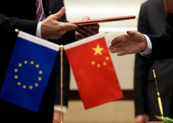 Chinese and European Union officials discuss trade cooperation and economic relations. - AP Photo/Andy Wong, File