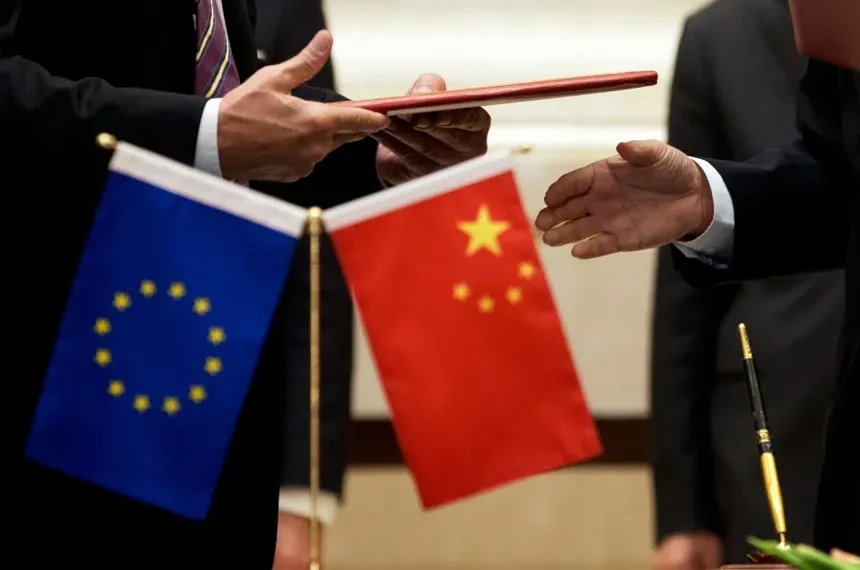 Chinese and European Union officials discuss trade cooperation and economic relations. - AP Photo/Andy Wong, File