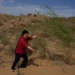 Workers maintain straw checkerboards and vegetation in China's Kubuqi Desert. - AP Photo/Ng Han Guan