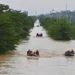 Rescue teams evacuate residents from severe flooding in Guangxi, southern China. - Zhou Hua/Xinhua via AP
