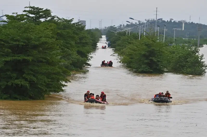 Rescue teams evacuate residents from severe flooding in Guangxi, southern China. - Zhou Hua/Xinhua via AP