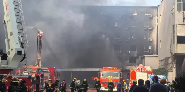 Smoke rises from a shoe factory after a deadly fire in Jinjiang, Fujian. - Zheng Liang/Xinhua via AP