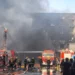 Smoke rises from a shoe factory after a deadly fire in Jinjiang, Fujian. - Zheng Liang/Xinhua via AP