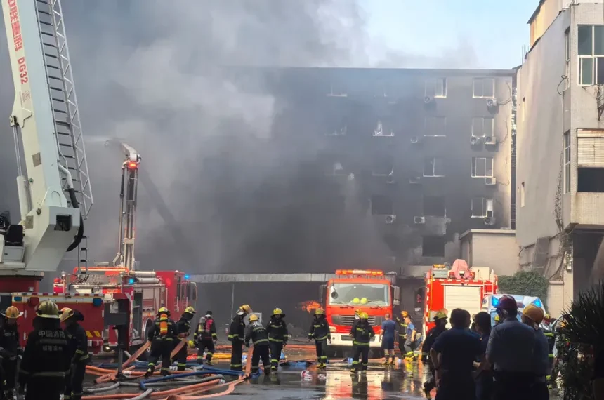 Smoke rises from a shoe factory after a deadly fire in Jinjiang, Fujian. - Zheng Liang/Xinhua via AP