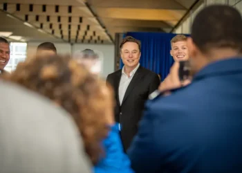 Elon Musk poses with U.S. Air Force Academy cadets during a visit to the academy in Colorado, alongside military personnel and academy leadership.