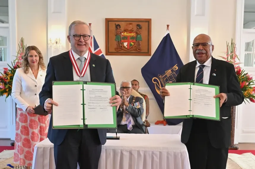 Australian and Fijian leaders sign a defense agreement in Suva. - Mick Tsikas/AAP image via AP1