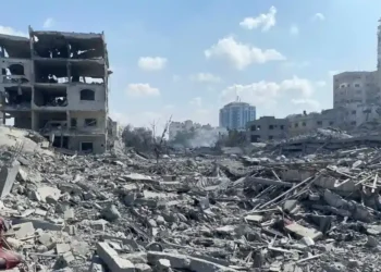 Damaged residential buildings in Gaza City's Rimal neighborhood following an Israeli airstrike during the early days of the Gaza war in October 2023.