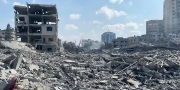 Damaged residential buildings in Gaza City's Rimal neighborhood following an Israeli airstrike during the early days of the Gaza war in October 2023.