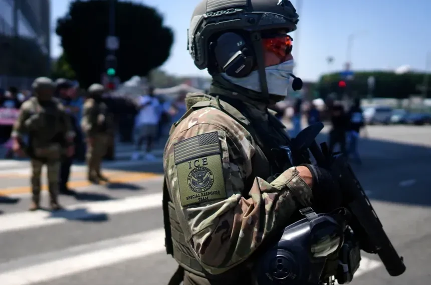 ICE officers during immigration enforcement amid debate over body camera deployment - AP Photo/Eric Thayer, File