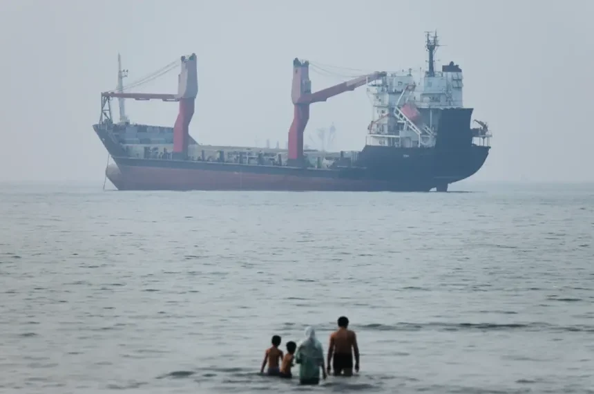 Commercial oil tankers transit the Strait of Hormuz amid rising regional tensions. - Amirhosein Khorgooi/SNA via AP