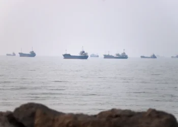 Commercial ships transit the Strait of Hormuz amid renewed US-Iran diplomatic tensions. - Amirhosein Khorgooi/ISNA via AP
