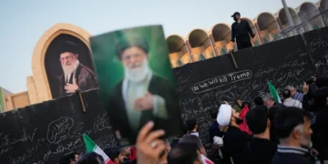 Mourners attend Ayatollah Ali Khamenei's funeral procession in Tehran, Iran. - AP Photo/Altaf Qadri