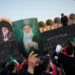 Mourners attend Ayatollah Ali Khamenei's funeral procession in Tehran, Iran. - AP Photo/Altaf Qadri