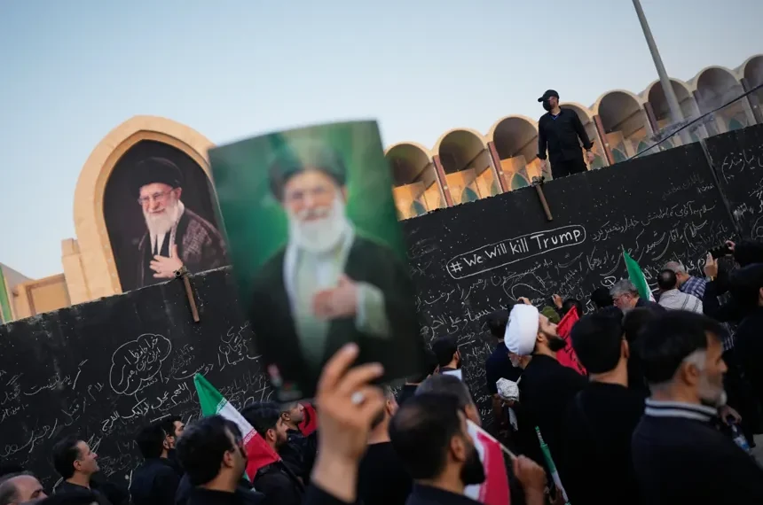 Mourners attend Ayatollah Ali Khamenei's funeral procession in Tehran, Iran. - AP Photo/Altaf Qadri