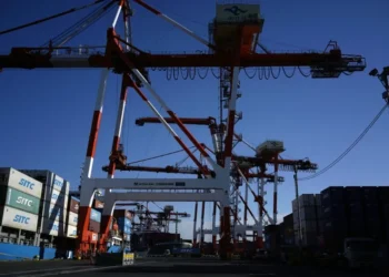 Business district in Tokyo reflecting improving corporate confidence in Japan. - AP Photo/Eugene Hoshiko