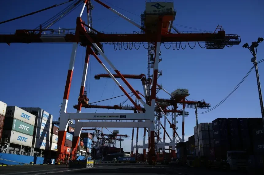 Business district in Tokyo reflecting improving corporate confidence in Japan. - AP Photo/Eugene Hoshiko