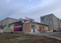 View of a commercial building along Lenina Street in Uchaly, Bashkortostan, Russia.
