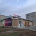 View of a commercial building along Lenina Street in Uchaly, Bashkortostan, Russia.