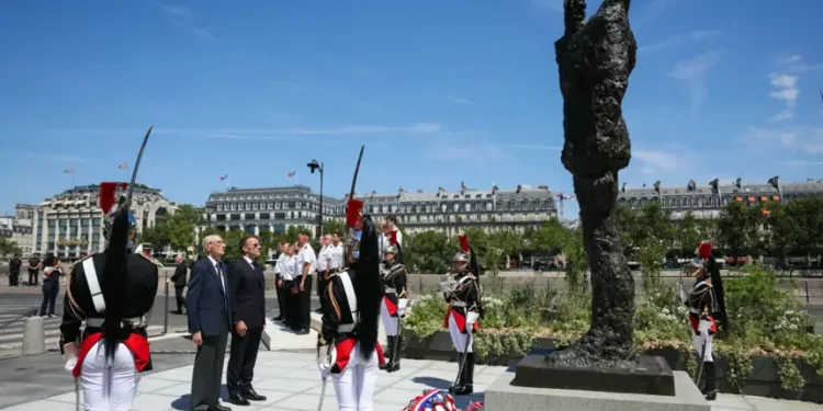 French President Emmanuel Macron attends the unveiling of the Alfred Dreyfus statue in Paris. - Thomas Samson/Pool Photo via AP
