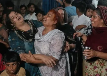 Rescue workers search collapsed tutoring center after deadly roof failure in Lahore - AP Photo/K.M Chaudary