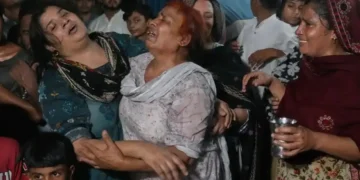 Rescue workers search collapsed tutoring center after deadly roof failure in Lahore - AP Photo/K.M Chaudary