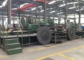 Exterior view of the Sichuan Jinxing Compressor Manufacturing Co., Ltd. factory in Chengdu, China, showing industrial buildings and manufacturing facilities.