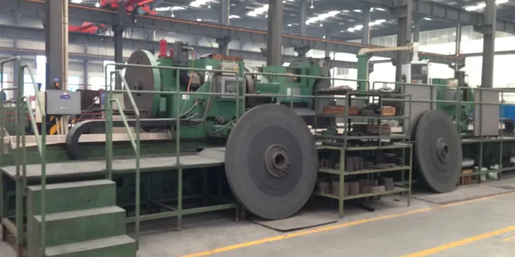 Exterior view of the Sichuan Jinxing Compressor Manufacturing Co., Ltd. factory in Chengdu, China, showing industrial buildings and manufacturing facilities.