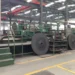 Exterior view of the Sichuan Jinxing Compressor Manufacturing Co., Ltd. factory in Chengdu, China, showing industrial buildings and manufacturing facilities.