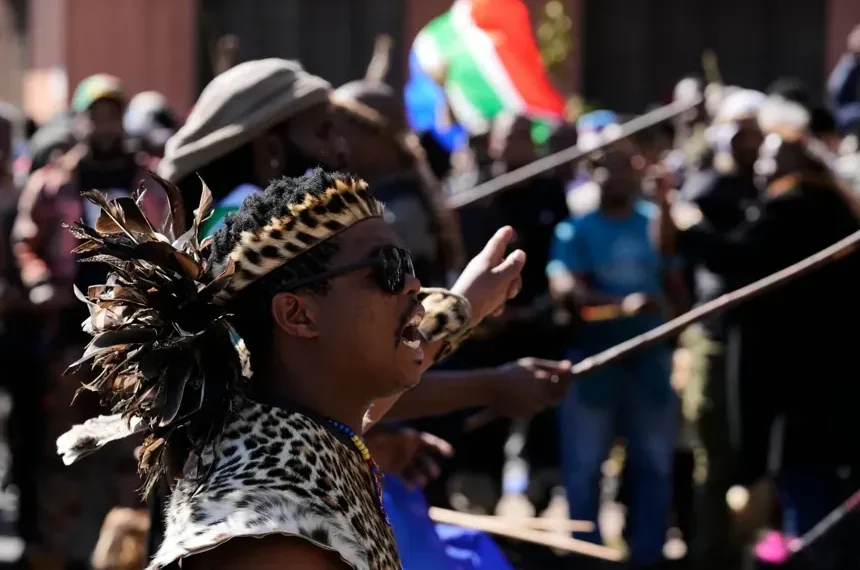 Demonstrators march during anti-immigration protests in Johannesburg - AP Photos/Themba Hadebe