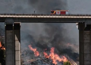 Firefighters battle a deadly wildfire in Spain's Almeria province. - AP Photo/Gregorio Marrero