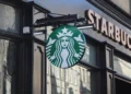 Exterior of a Starbucks coffee shop on the Royal Mile in Edinburgh, Scotland, displaying the company's storefront and signage.
