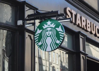 Exterior of a Starbucks coffee shop on the Royal Mile in Edinburgh, Scotland, displaying the company's storefront and signage.
