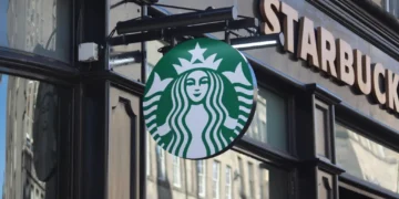 Exterior of a Starbucks coffee shop on the Royal Mile in Edinburgh, Scotland, displaying the company's storefront and signage.