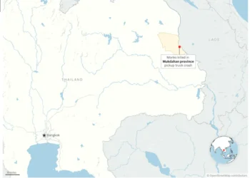 Emergency responders at the scene after a pickup truck struck Buddhist monks in Thailand. - © OpenStreetMap contributors - Graphic: Will Jarrett Associated Press
