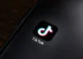 TikTok app icon displayed on the home screen of a smartphone for editorial illustration of the social media platform.