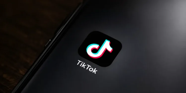 TikTok app icon displayed on the home screen of a smartphone for editorial illustration of the social media platform.