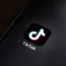 TikTok app icon displayed on the home screen of a smartphone for editorial illustration of the social media platform.