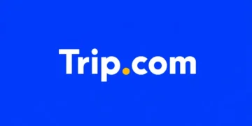 Trip.com app logo displayed on the home screen of a smartphone for editorial illustration of the online travel platform.
