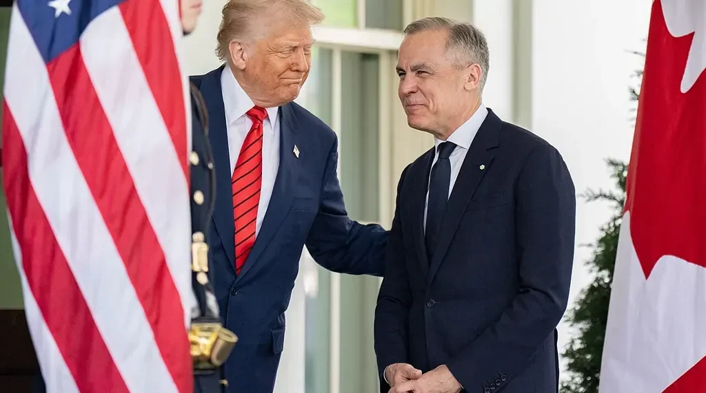 President Donald Trump greets Canadian Prime Minister Mark Carney outside the West Wing entrance of the White House before their meeting in Washington.