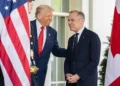 President Donald Trump greets Canadian Prime Minister Mark Carney outside the West Wing entrance of the White House before their meeting in Washington.