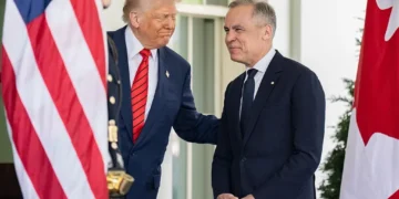President Donald Trump greets Canadian Prime Minister Mark Carney outside the West Wing entrance of the White House before their meeting in Washington.
