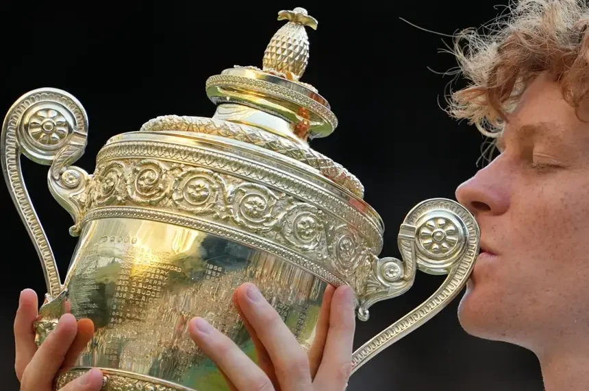 Jannik Sinner celebrates after winning the Wimbledon men's singles title. - AP Photo/Kin Cheung