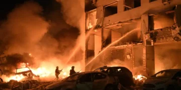 Emergency responders search damaged apartment buildings after a Russian missile attack in Kyiv. - AP Photo/Danylo Antoniuk