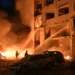 Emergency responders search damaged apartment buildings after a Russian missile attack in Kyiv. - AP Photo/Danylo Antoniuk