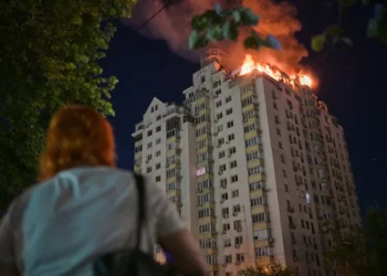 Emergency responders near damaged residential buildings after overnight strikes in Kyiv - AP Photo/Danylo Antoniuk