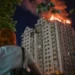 Emergency responders near damaged residential buildings after overnight strikes in Kyiv - AP Photo/Danylo Antoniuk