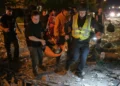 Emergency workers search damaged buildings after Russian missile strikes in Kyiv. - AP Photo/Danylo Antoniuk