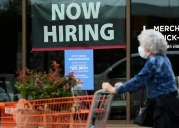 Workers at a U.S. business following release of the June employment report. - AP Photo/Nam Y. huh, File